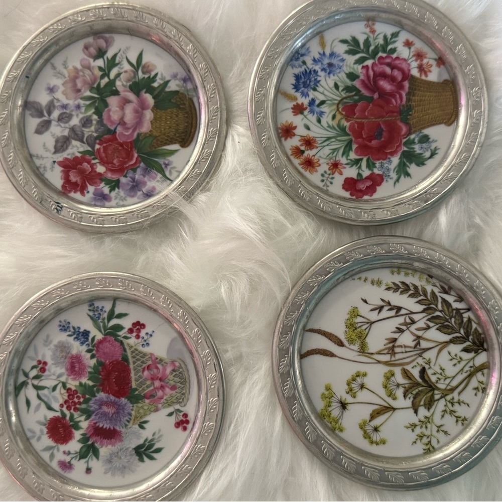 Vintage German porcelain coasters trimmed in pewter with flower bouquets